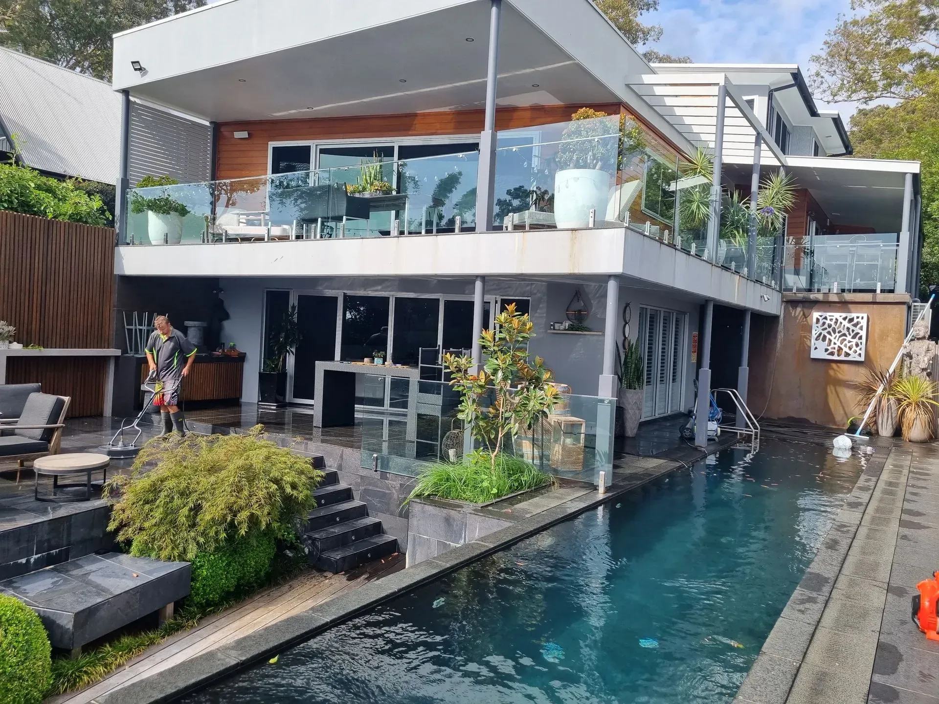 A Large House With a Swimming Pool in Front of It — All Clean Pressure Cleaning in Valentine, NSW