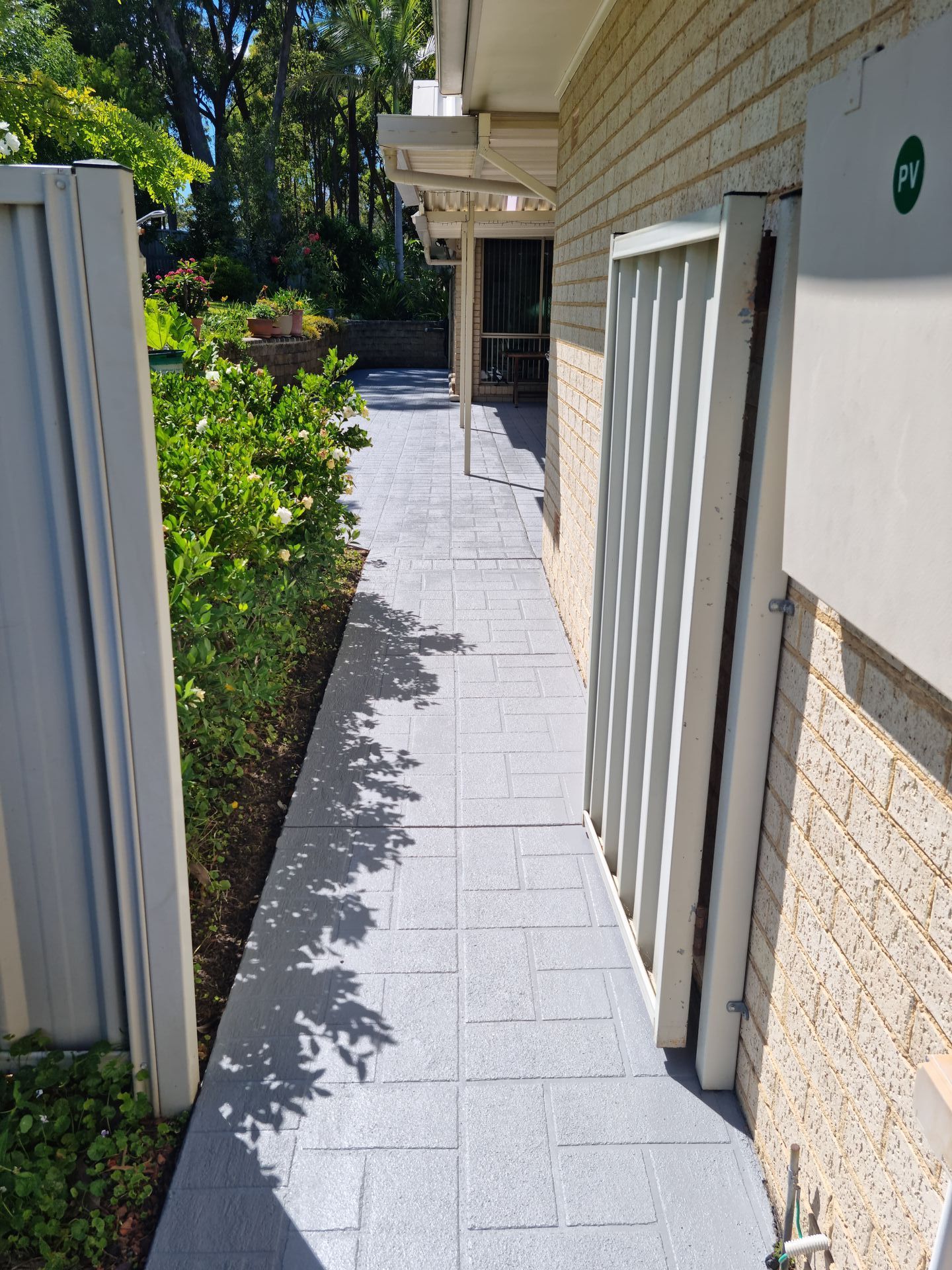 A Sidewalk Leading to a House With a White Fence — All Clean Pressure Cleaning in Valentine, NSW