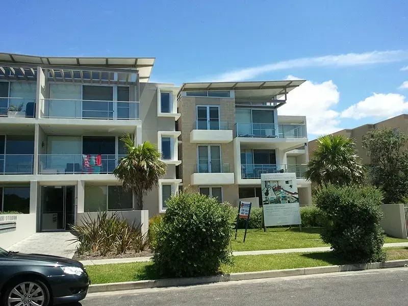 A Black Car is Parked in Front of a Building — All Clean Pressure Cleaning in Valentine, NSW