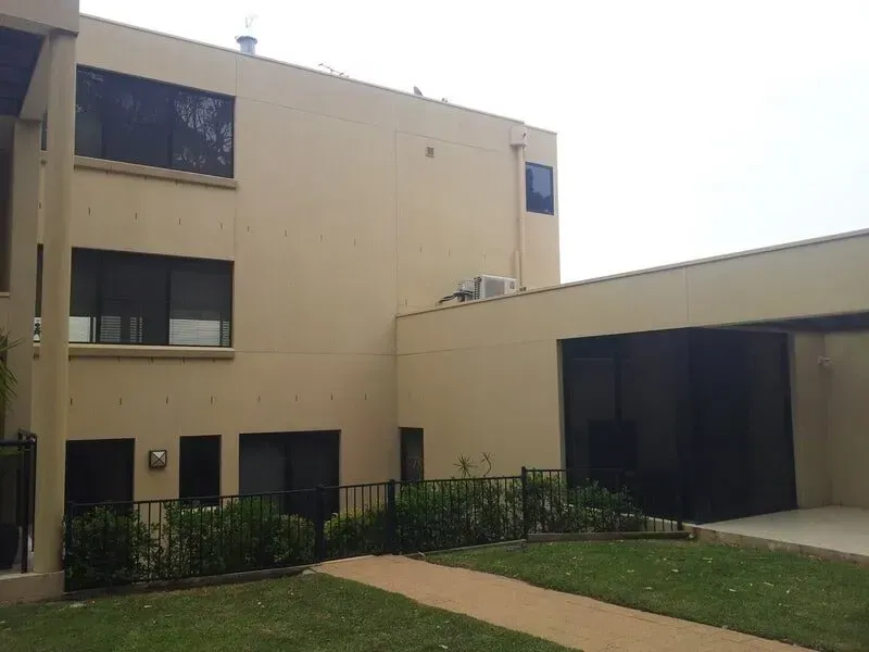 A Large Building With a Lot of Windows and a Walkway Leading to It — All Clean Pressure Cleaning in Valentine, NSW