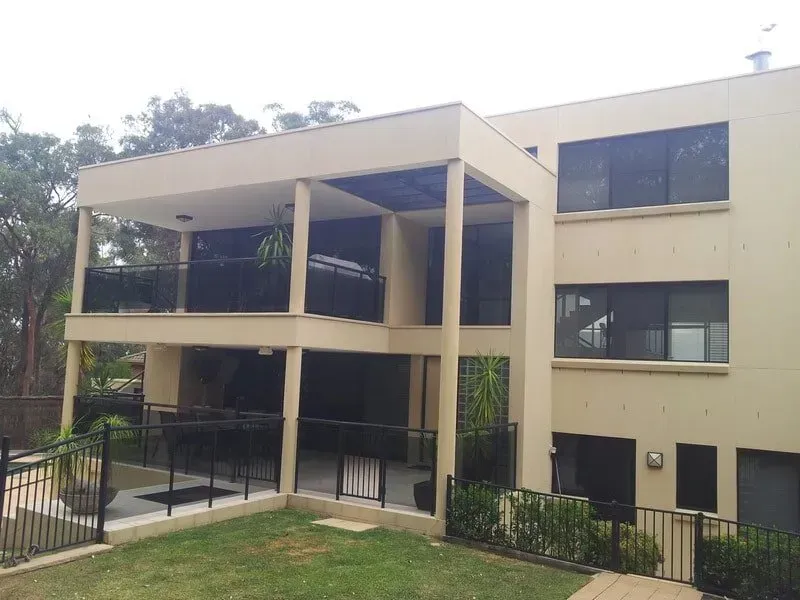 A Large Building With a Balcony and a Fence Around It — All Clean Pressure Cleaning in Valentine, NSW