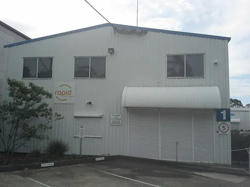 A White Building With the Word Rapid on It — All Clean Pressure Cleaning in Valentine, NSW