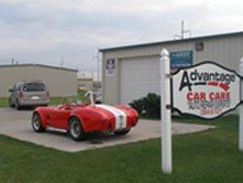 Carburetors — Red Car at the Storefront in Grand Island, NE