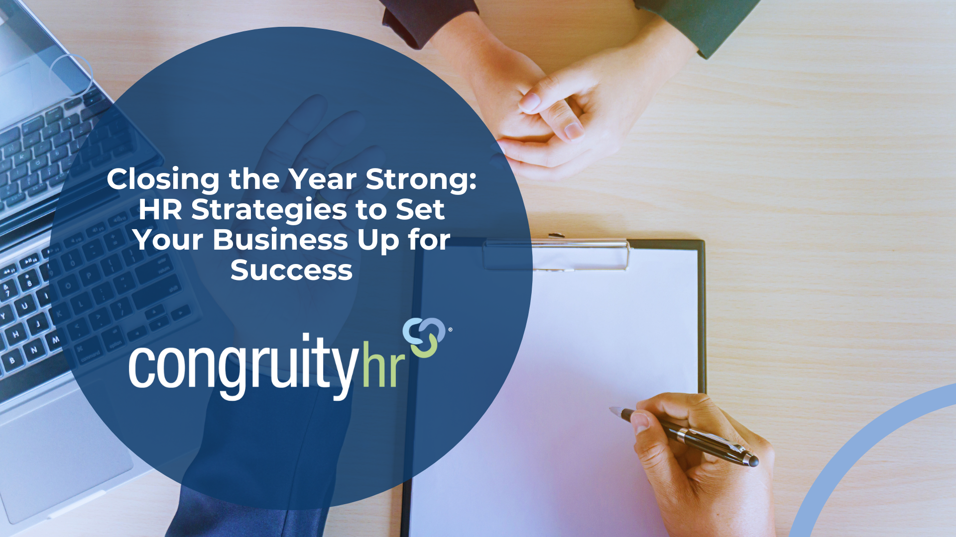 Hands meeting over a clipboard and a laptop. Text: 