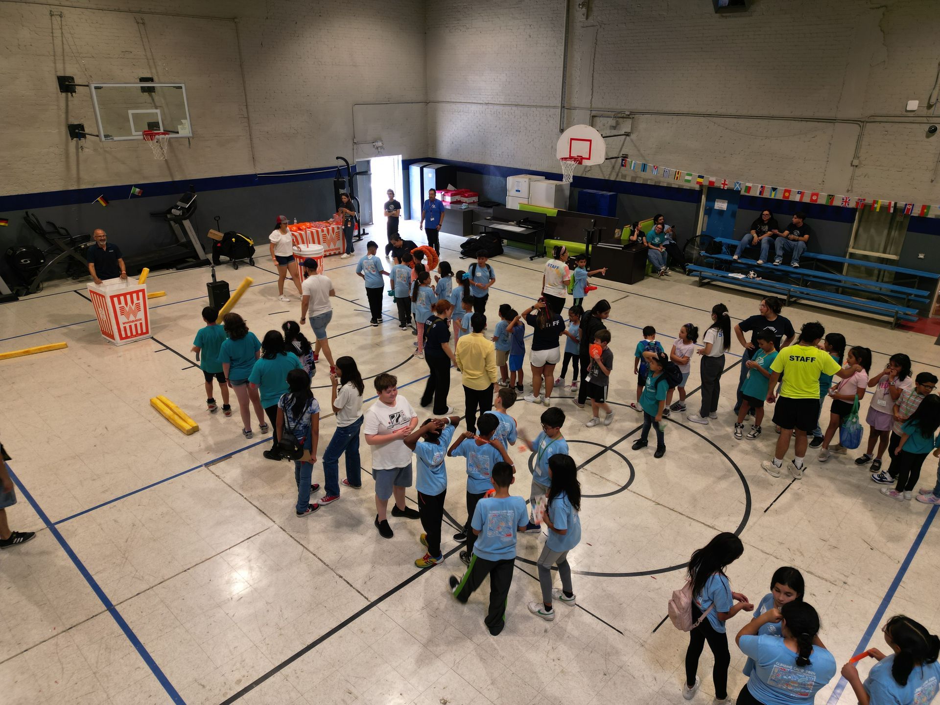 El Paso youth participating in a hands-on drone and STEM education summer program at the Boys & Girls Club of El Paso gym.