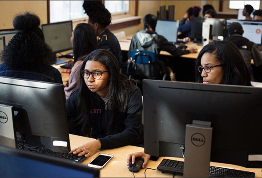 Students in an El Paso computer lab conducting coursework on modern computers.