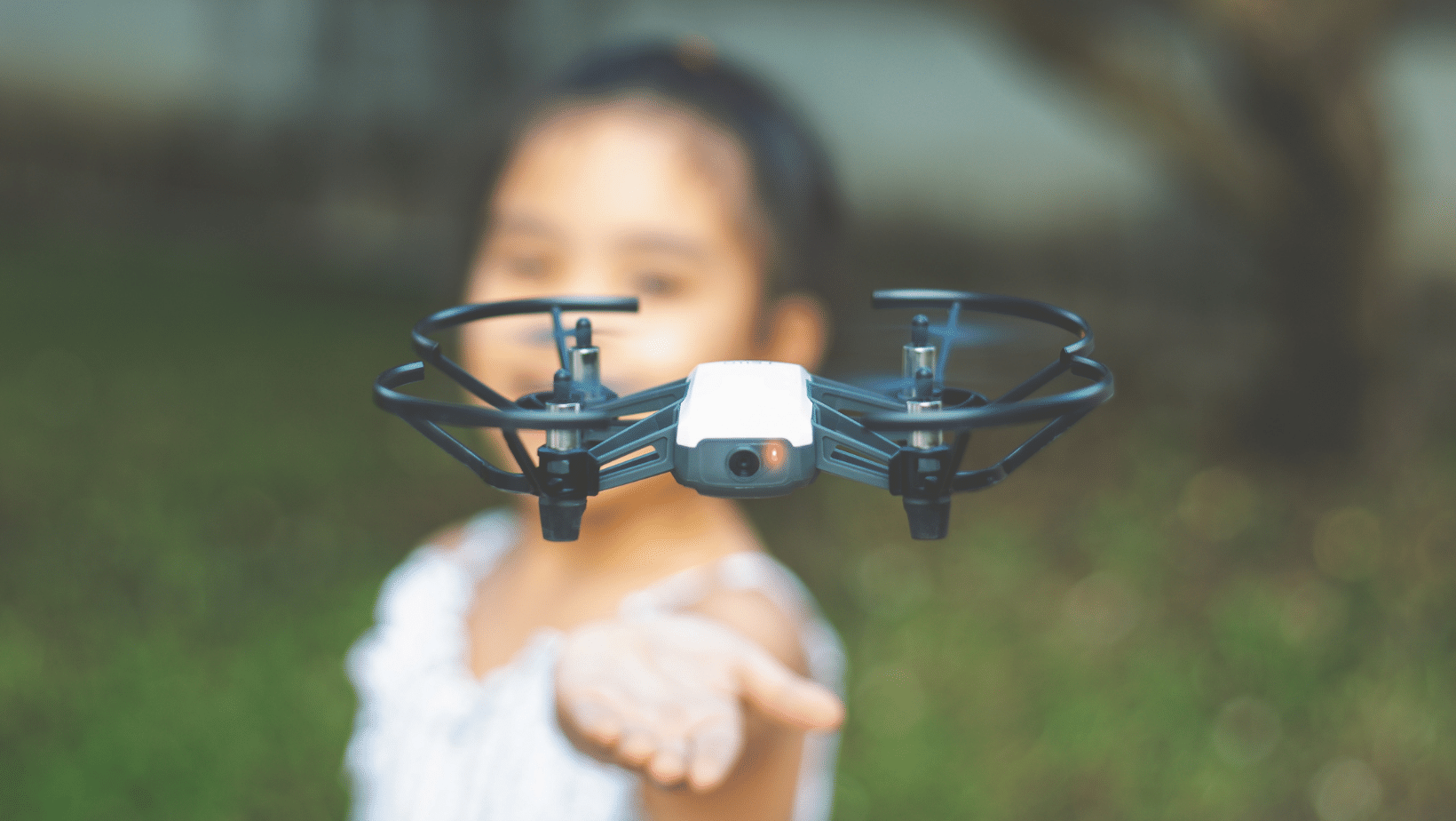 drone flying to little girl