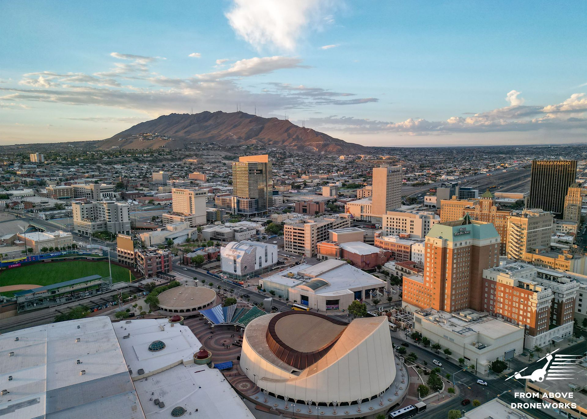Downtown El Paso with Mountain View: An image capturing the downtown area of El Paso with a picturesque mountainous backdrop. The photo displays the cityscape, buildings, streets, and possibly landmarks, framed against the backdrop of prominent mountains. It showcases the scenic beauty and urban landscape of downtown El Paso with the stunning mountainous vista in the background.