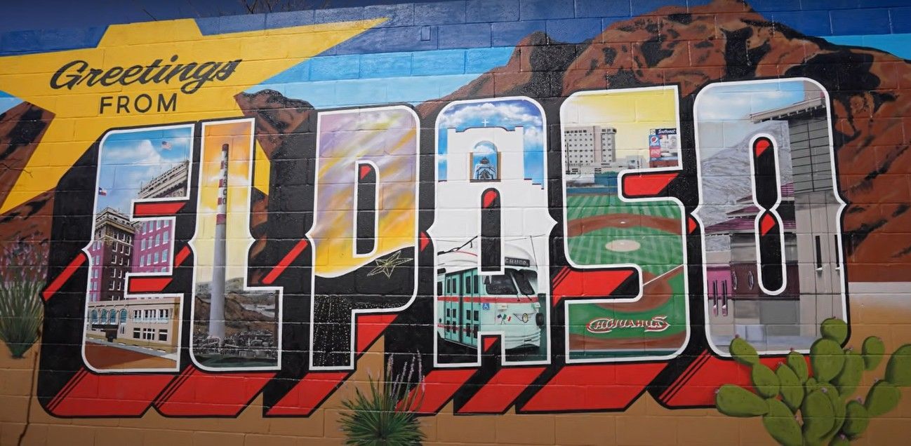 A mural on a wall that says greetings from El Paso, Texas.