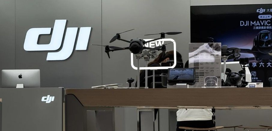 Retail display showing multiple DJI drone models available for purchase.