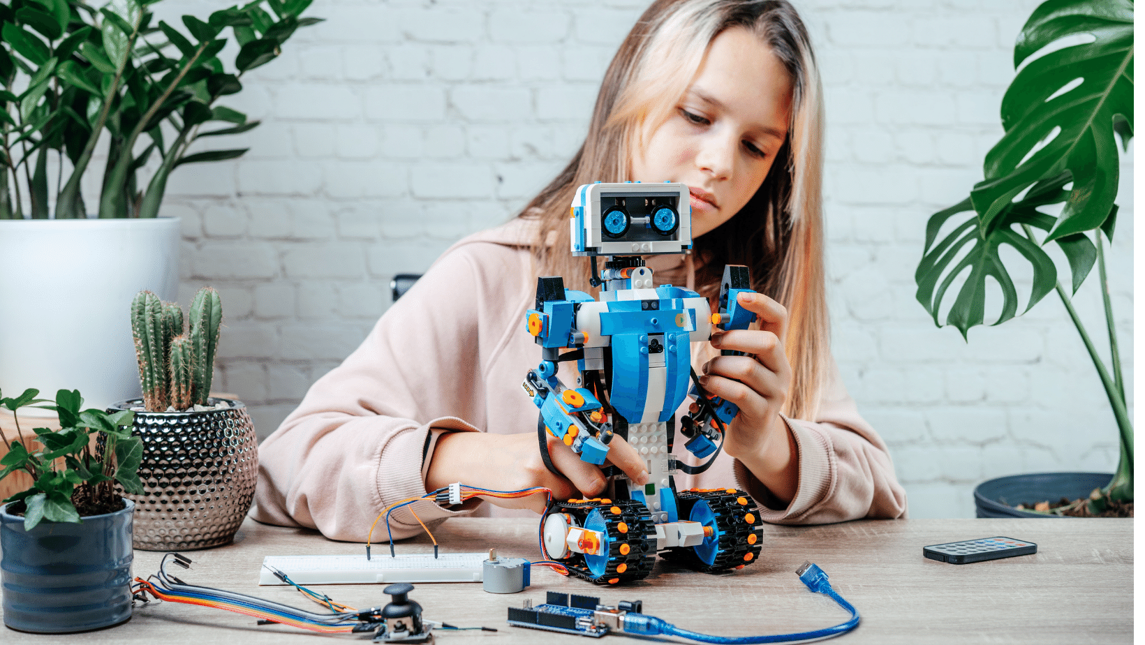 Girl building a robot