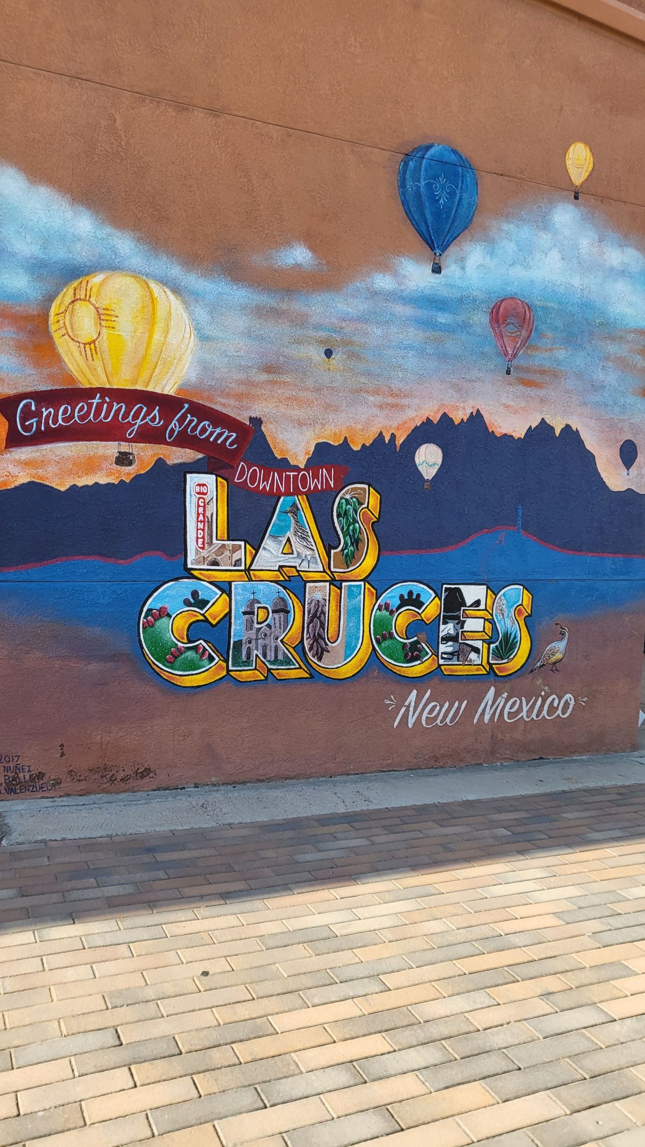 Color Me Cruces mural in Downtown Las Cruces featuring the words 'Greetings from Downtown Las Cruces'