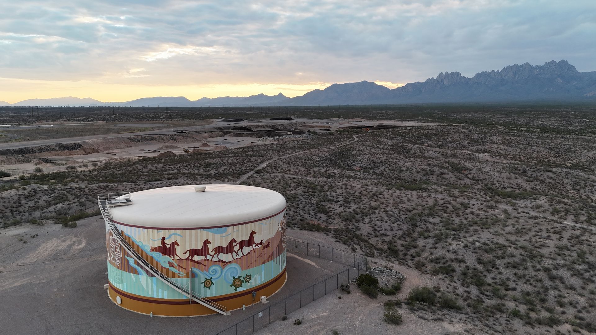 Colorful water tower mural in Las Cruces, NM, celebrating local culture and community pride. 