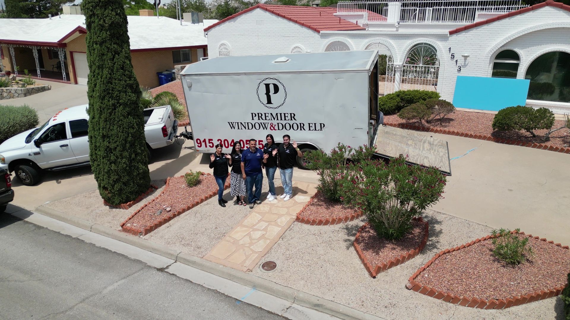 Premier Window & Door ELP staff waving in a professional drone marketing video showcasing the business location and team.