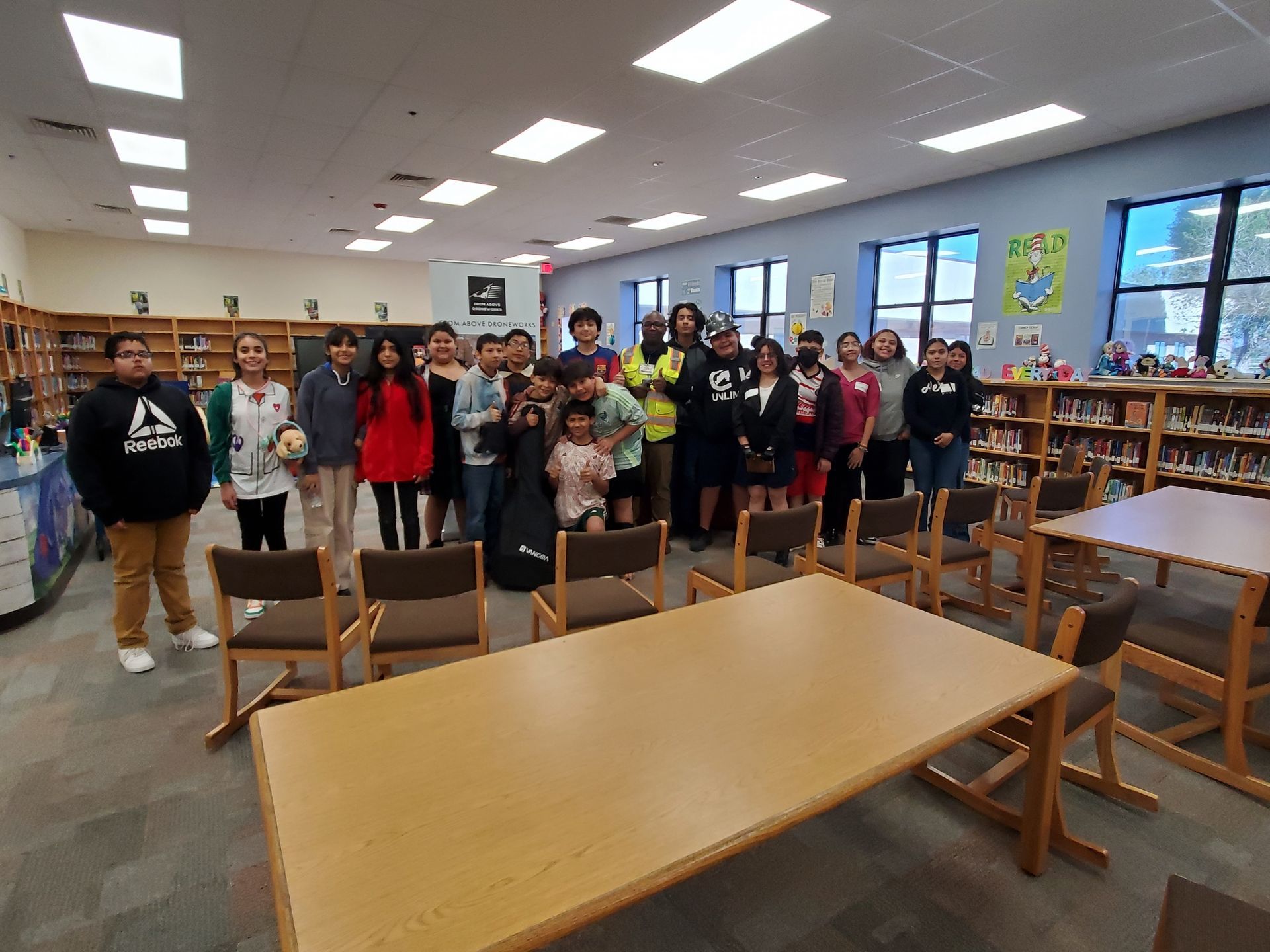 Students from Desert Trail Elementary School in Chaparral, NM, pose for a group photo in the library.