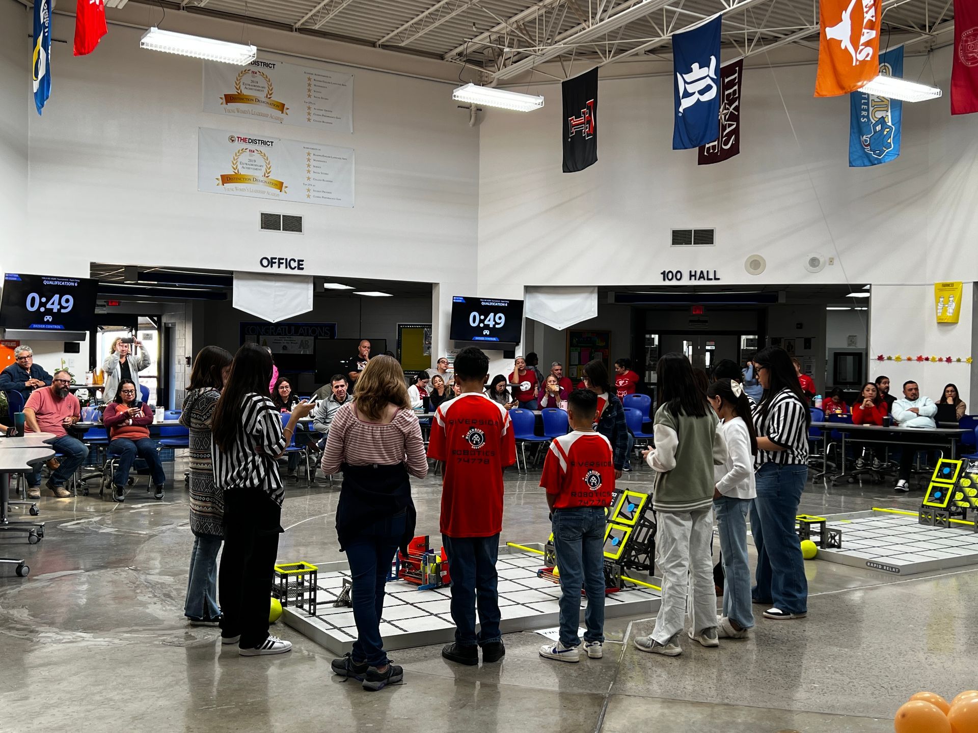 Students competing in robotics competition at YWLA in El Paso.