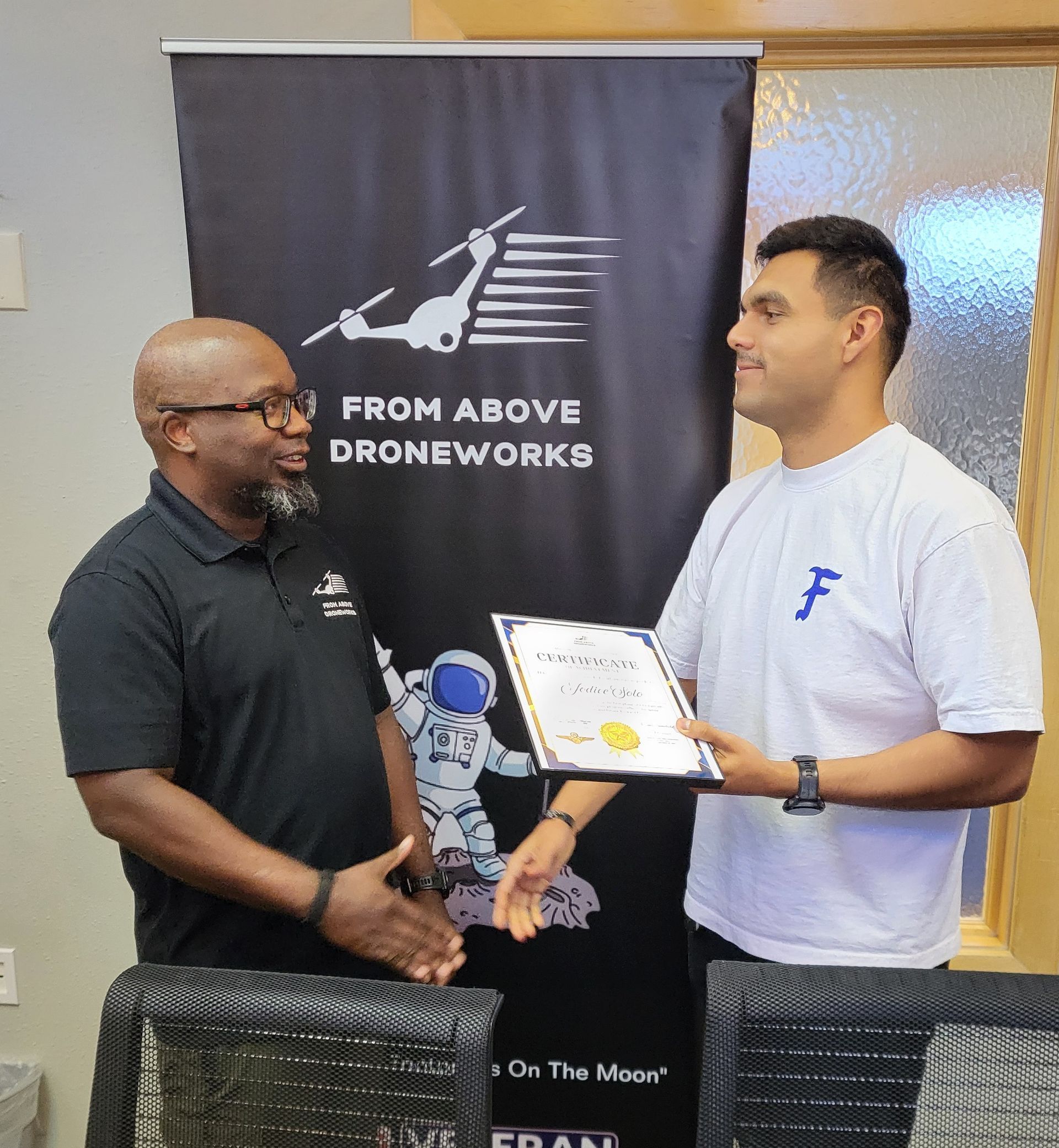 Bandit receiving FAA Part 107 certificate and badge in El Paso