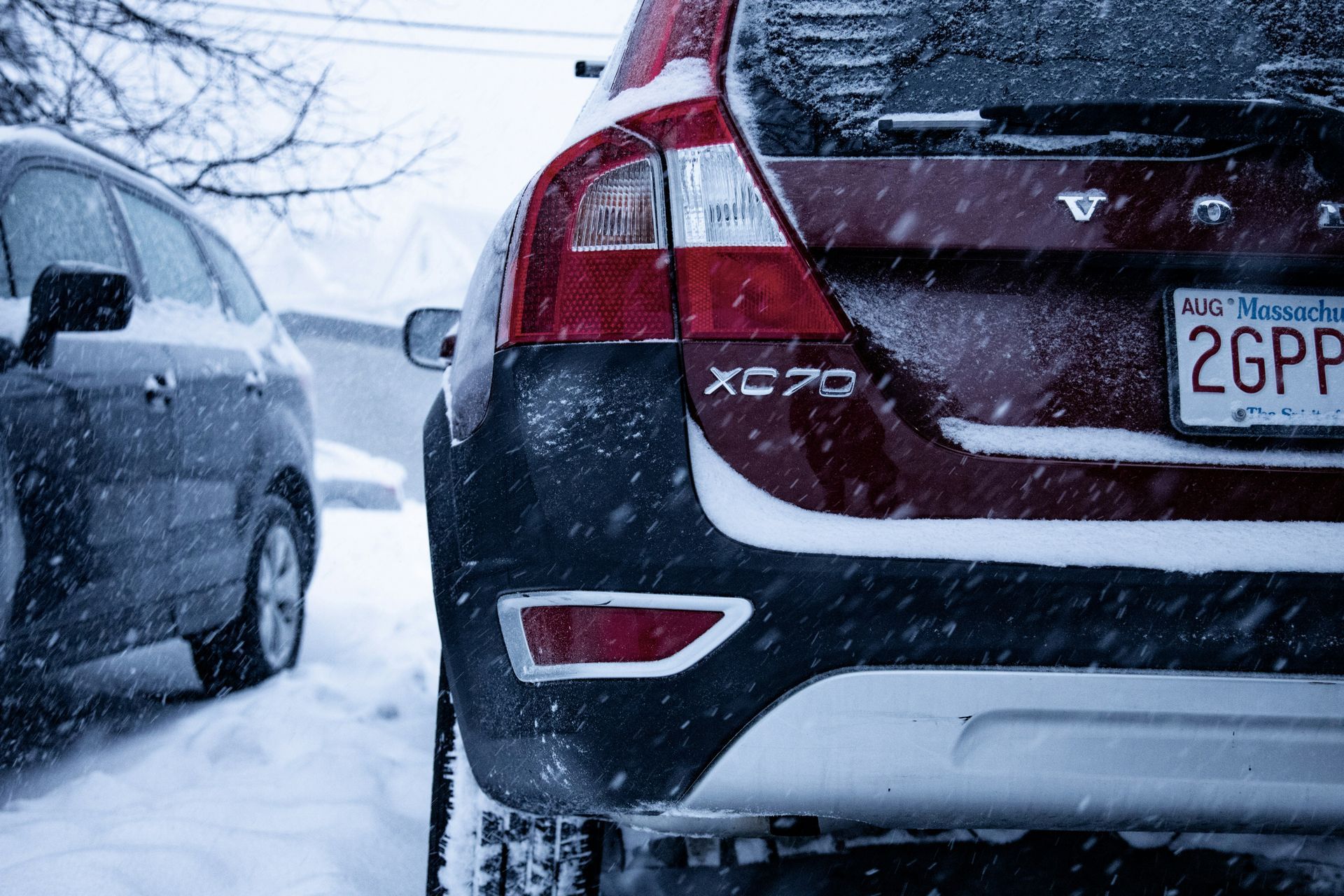 A volvo xc70 is parked in the snow