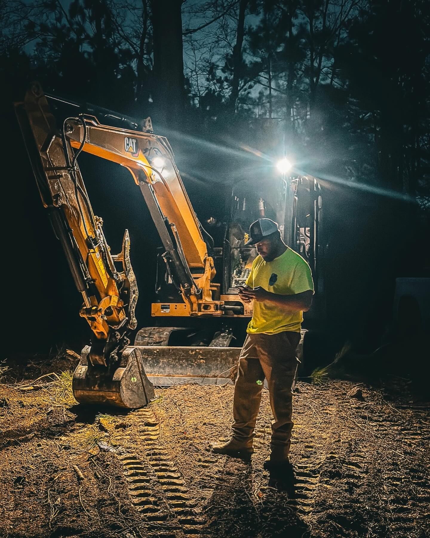 A terex tractor is parked in the woods