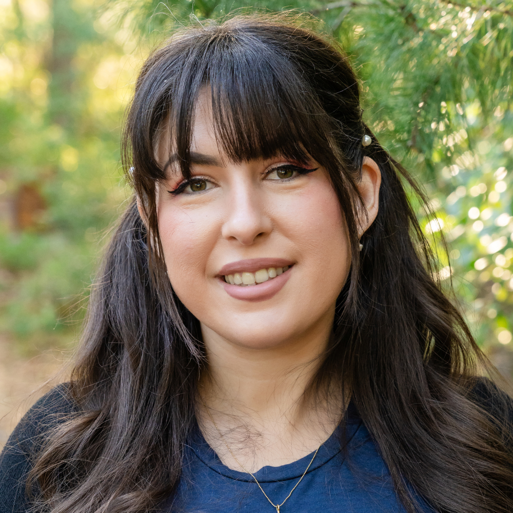 Office Coordinator, Michelle Mandarin smiling for her headshot