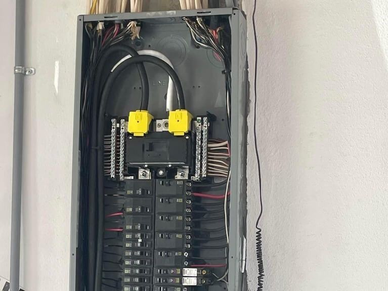 A close up of a electrical panel on a wall.