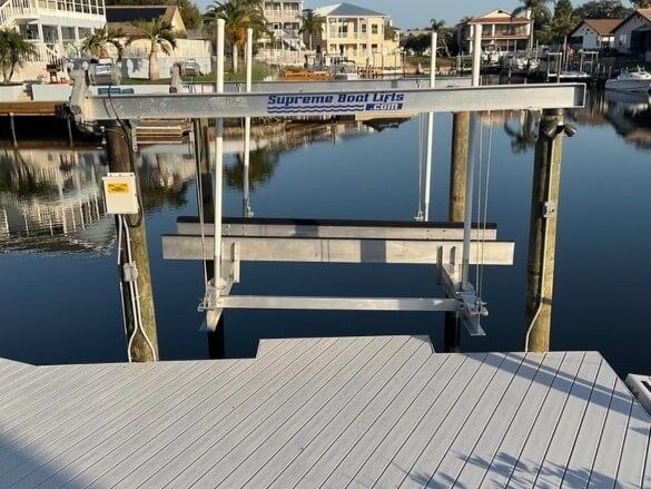A boat lift with the word supreme on it