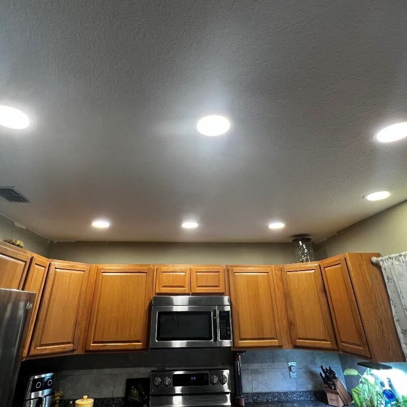 A kitchen with wooden cabinets and stainless steel appliances.