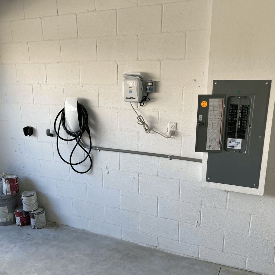 A white brick wall with a electrical box on it
