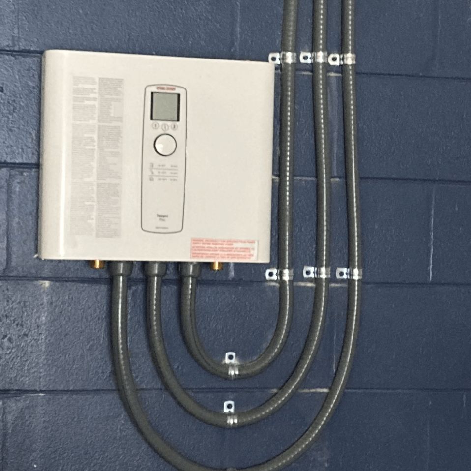 A white box with a remote control attached to it