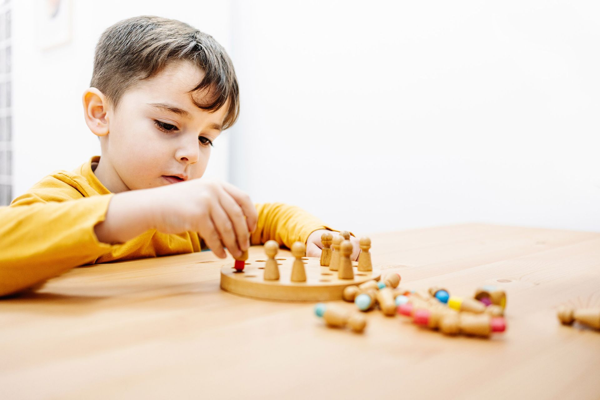 Little Kid Playing A Board Game — Palm Beach Gardens, FL — ABA Growth Team