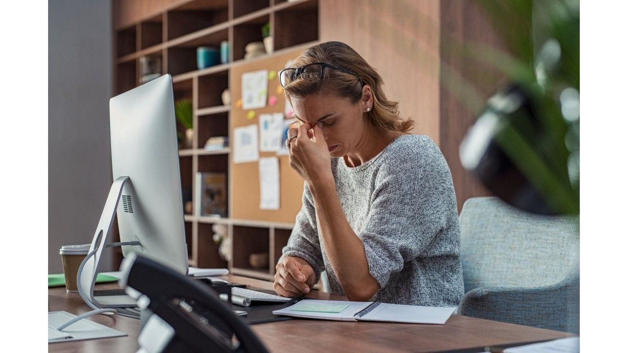 Picture of an ABA scheduler nursing a headache and looking exasperated