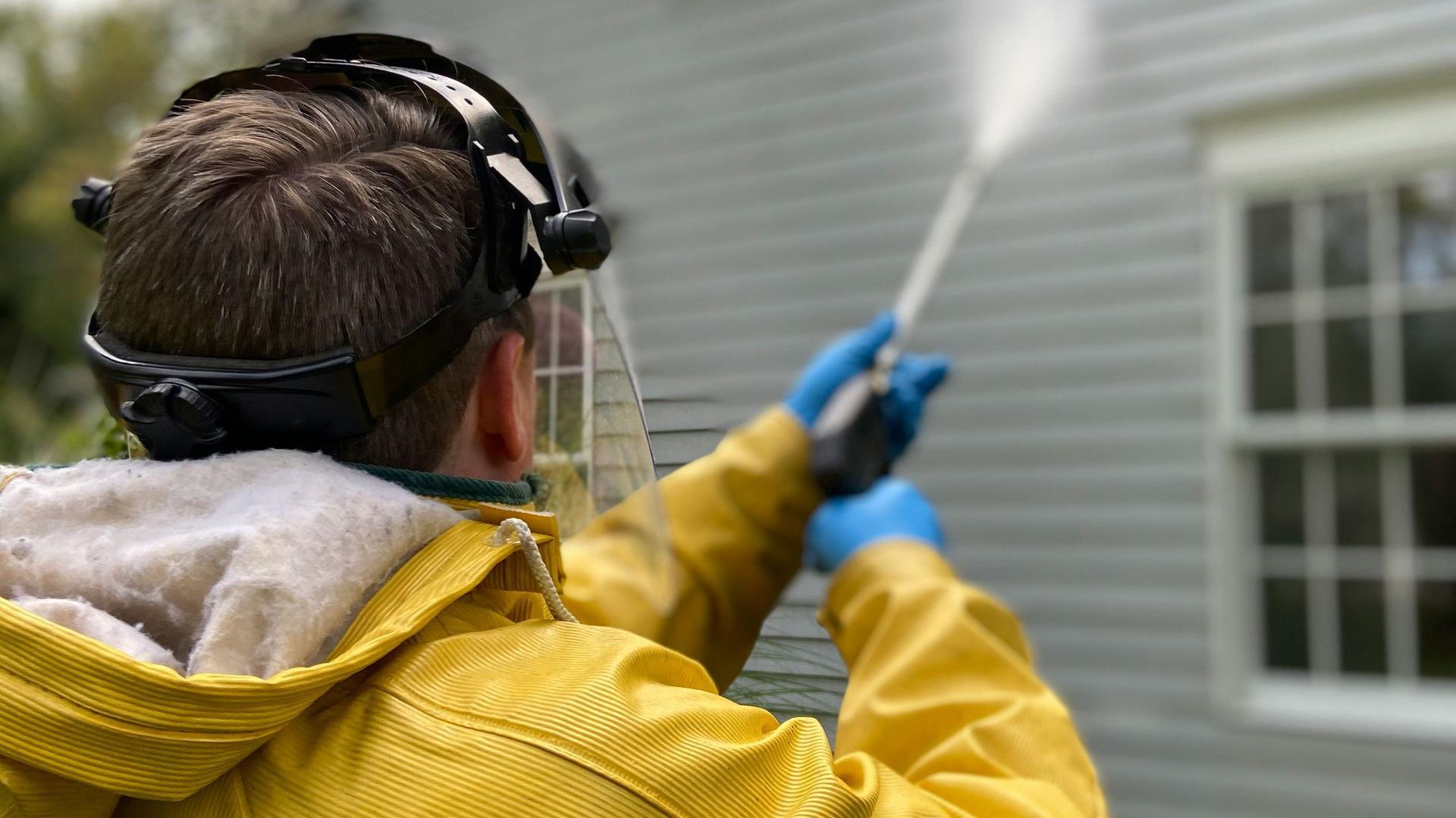 Professional repairing damaged drywall, using specialized tools to ensure a seamless finish, demonstrating expert drywall restoration techniques