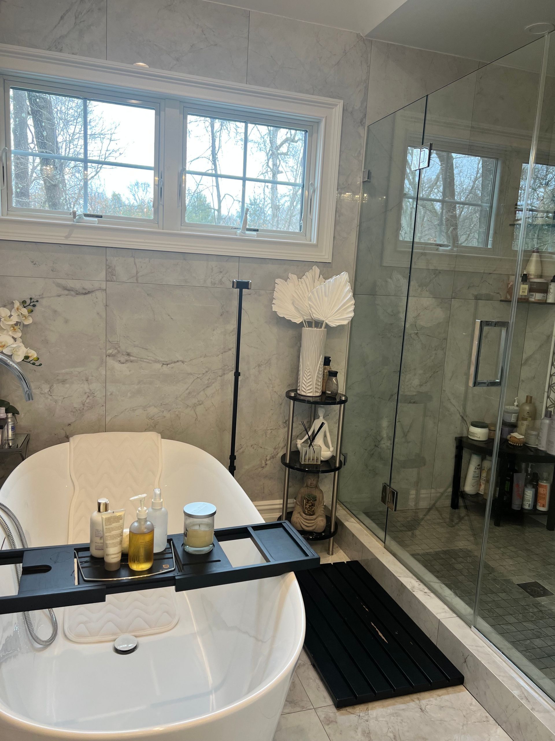 Amaya's Cleaning Service - A bathtub with a tray on top of it in a bathroom.