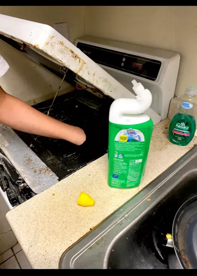 Amaya's Cleaning Service - A person is cleaning a stove with a bottle of dish soap on the counter