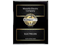 Black and gold business card for Martella Electric Company, with large "Electrician" text.