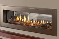 Modern wall-mounted fireplace with flames behind glass in a brown frame