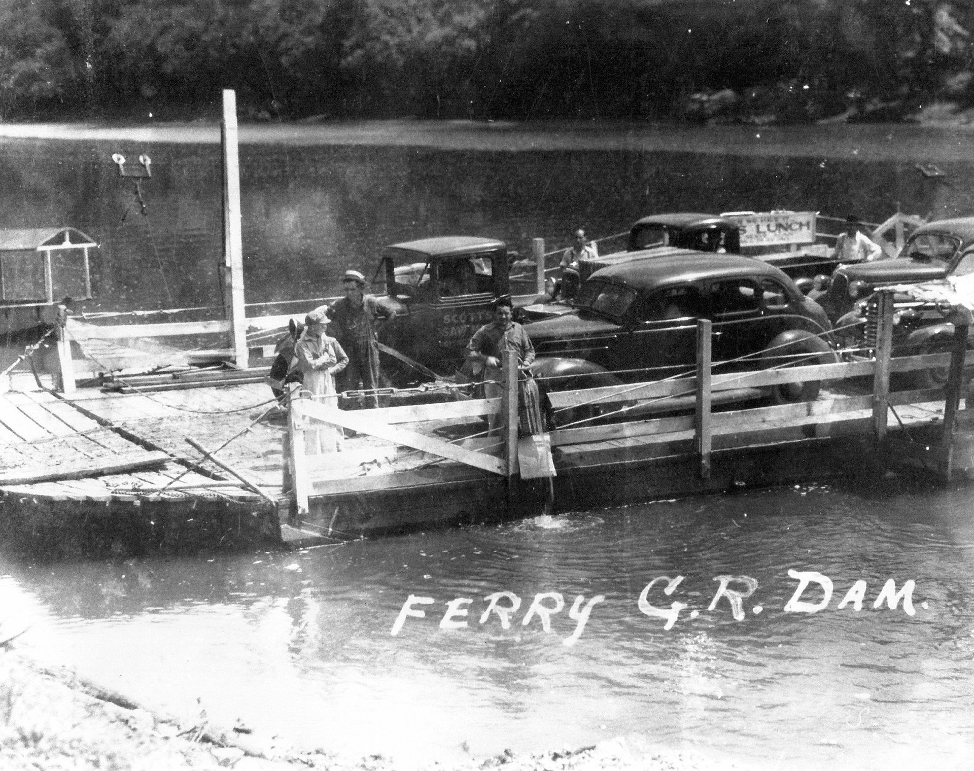 A black and white photo of a ferry g.r. dam