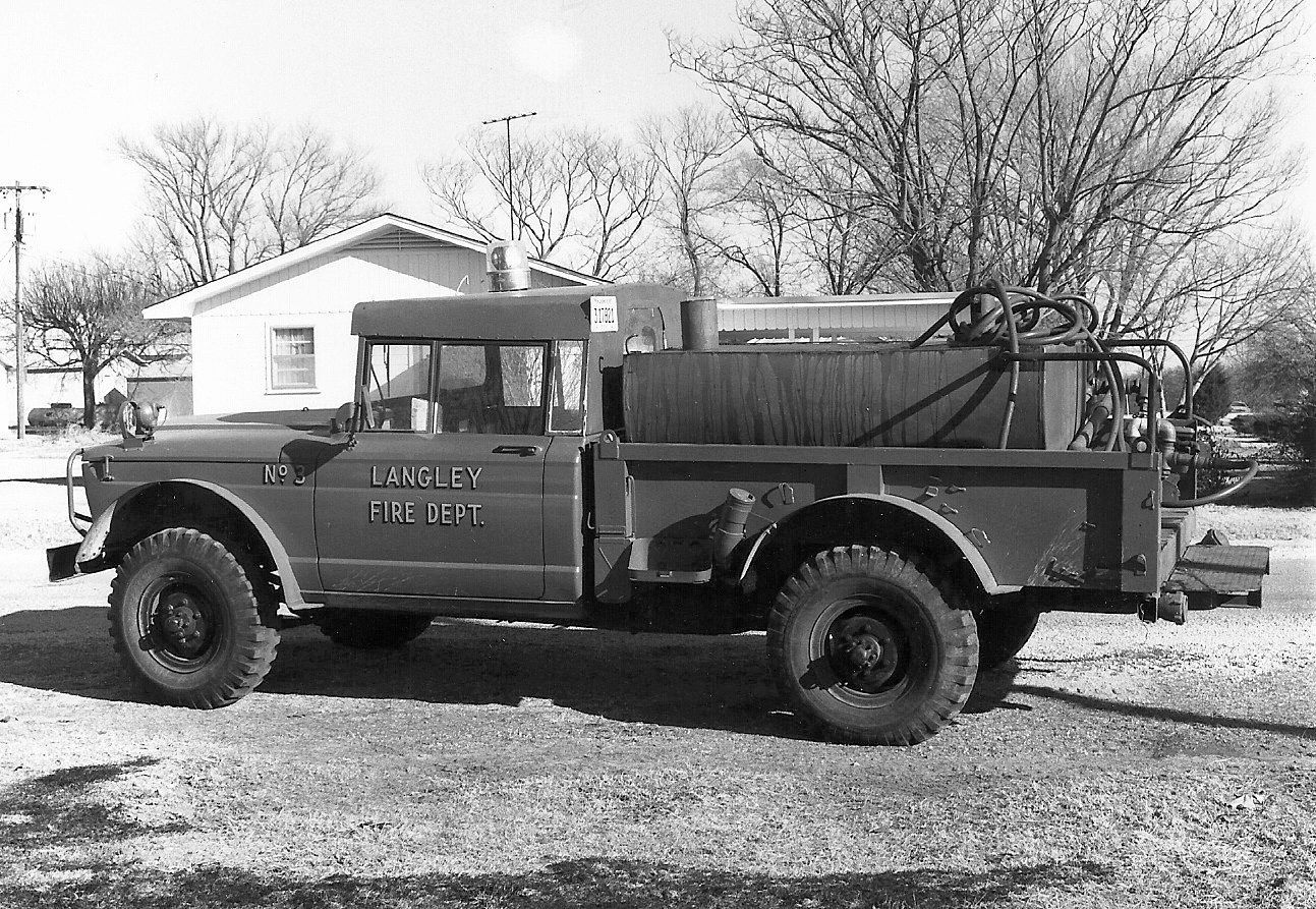A black and white photo of a truck that says Langley fire