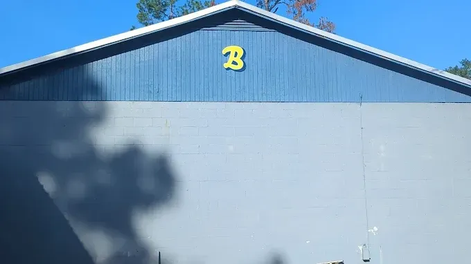 Blue and gray building with a yellow 