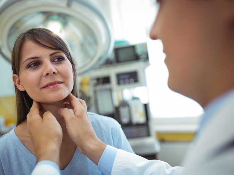 Doctor Checking Lymph Nodes of Patient — Omaha, NE — Arbor Heights Family Medicine