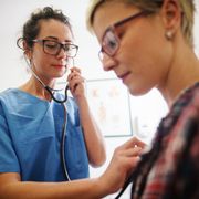 Doctor Using Stethoscope to Examine Patient — Omaha, NE — Arbor Heights Family Medicine