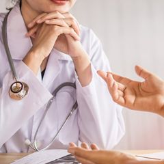 Female Doctor Listening to Depressed Patient — Omaha, NE — Arbor Heights Family Medicine