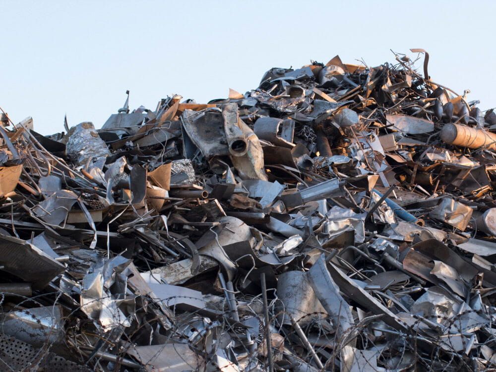 A Pile Of Scrap Metal Against A Blue Sky — Eco Skips In Midge Point, QLD