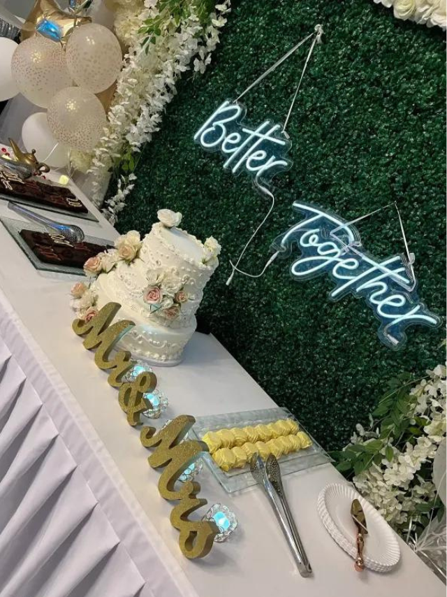 A table with a cake and a sign that says `` better together ''.