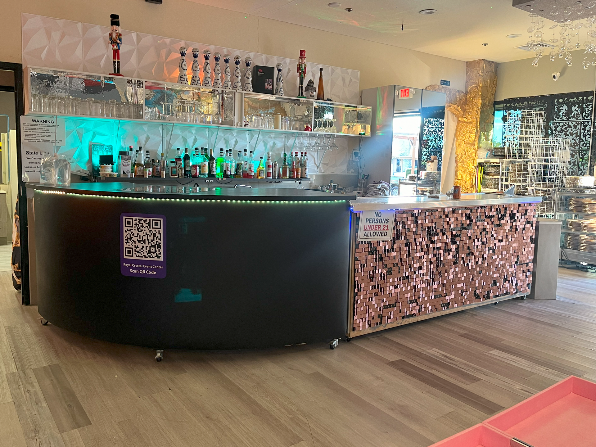 A bar in a restaurant with a qr code on the counter.