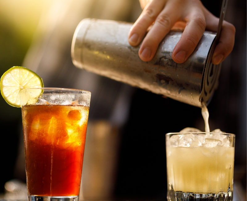 A large room with tables and chairs set up for a wedding reception.