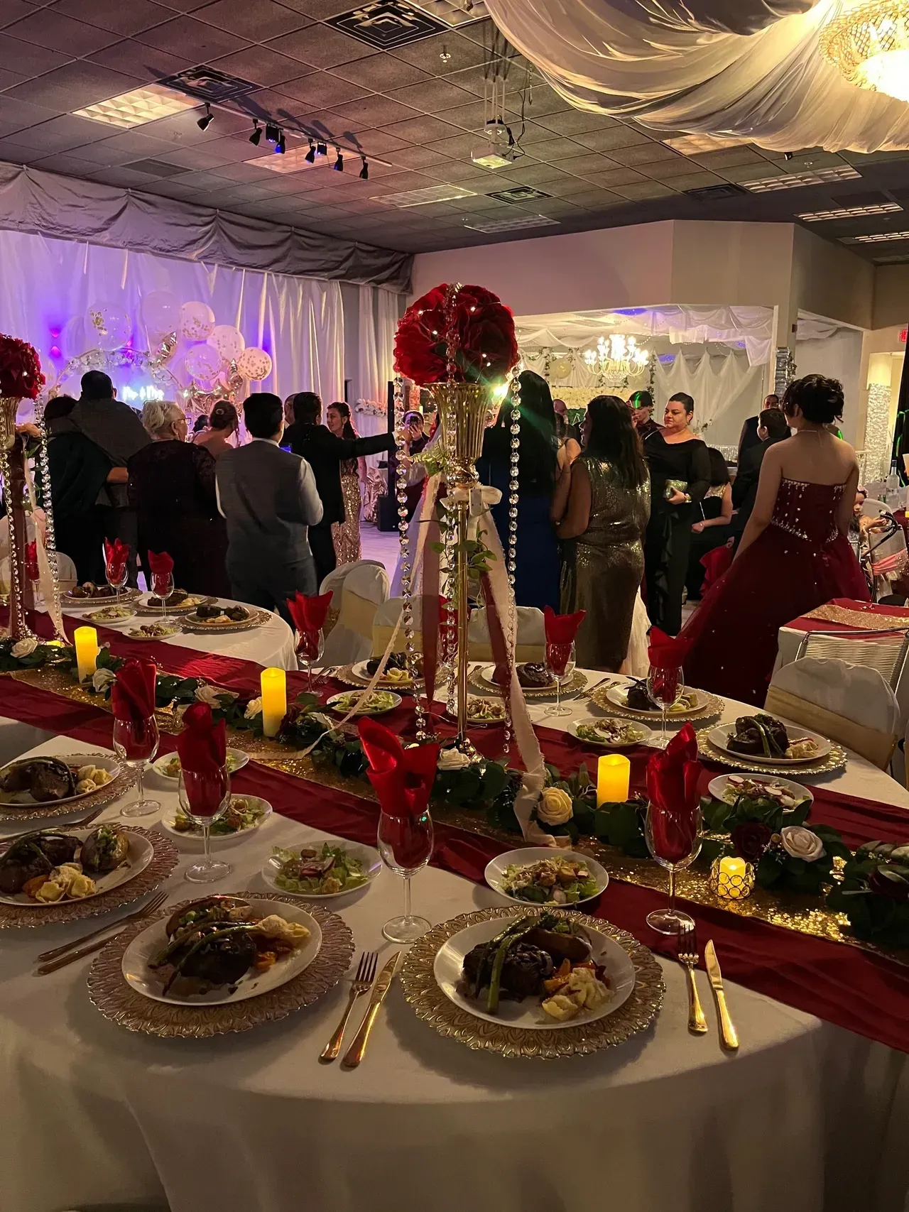A large room filled with tables and plates of food.