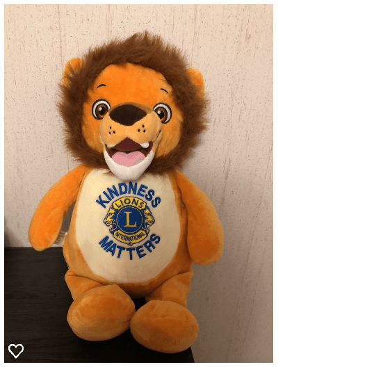 Stuffed lion with brown mane and the Lions Clubs International logo, with
