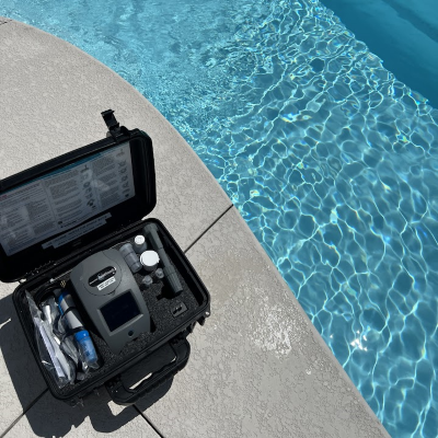Grey Shark Pool Services testing the pool water.