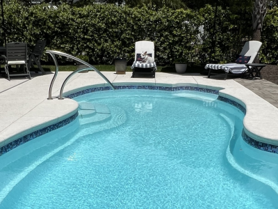 One of our clients puppies enjoying a beautiful Oak Island day by the pool